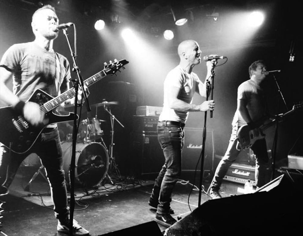 Destroy Oh Boy live under stage lights
